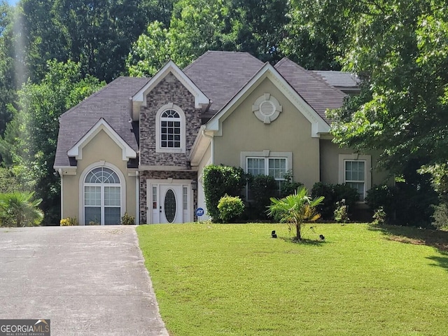 view of front of home with a front yard