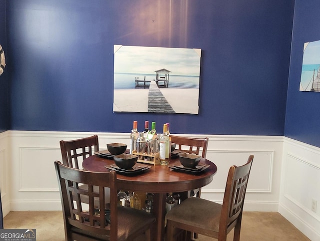 dining space with light carpet