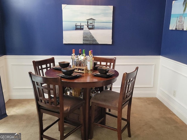 view of carpeted dining space