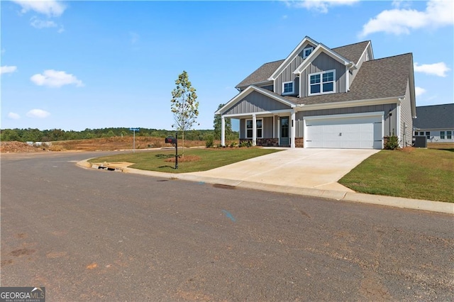 craftsman-style home featuring a front yard and a garage