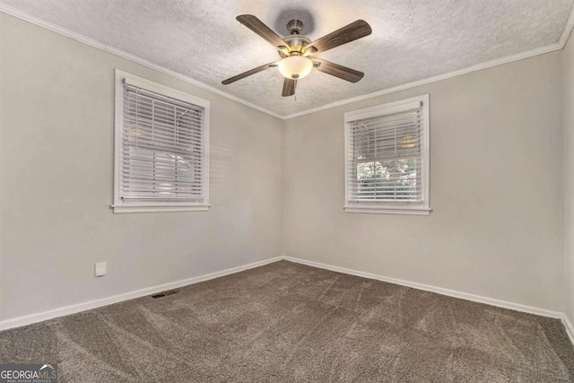 empty room featuring carpet, ceiling fan, crown molding, and a textured ceiling