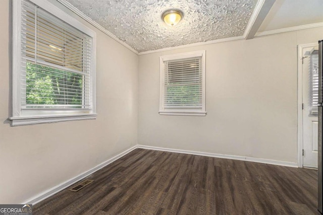 unfurnished room featuring dark hardwood / wood-style flooring, a textured ceiling, and ornamental molding