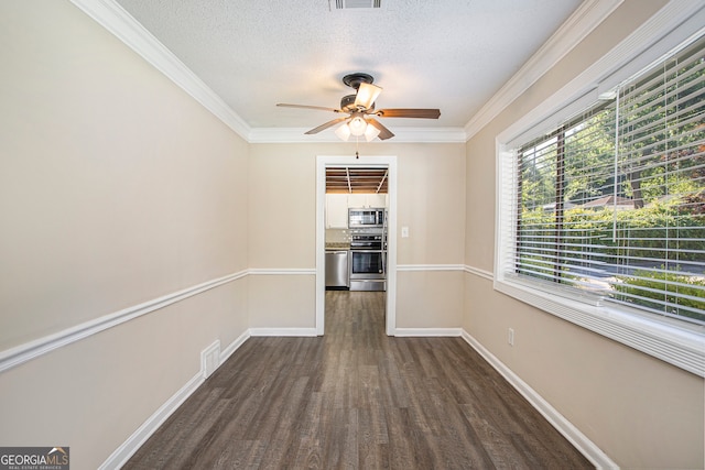 interior space featuring crown molding, dark hardwood / wood-style flooring, ceiling fan, and a textured ceiling