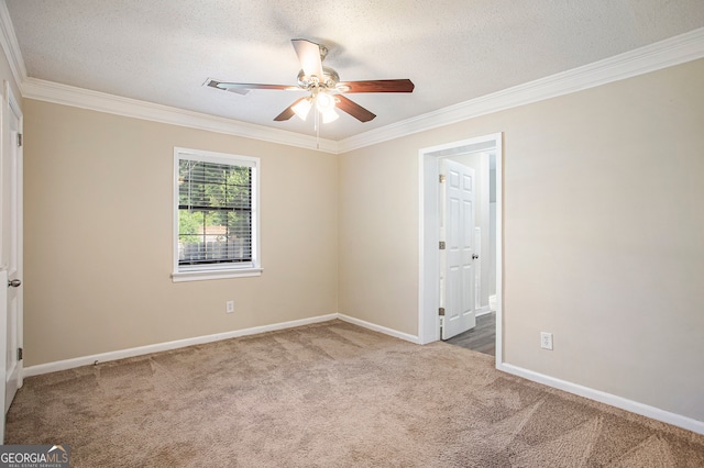 carpeted empty room with a textured ceiling and crown molding