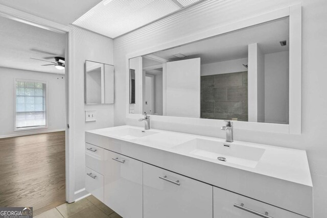 bathroom featuring vanity, ceiling fan, and wood-type flooring