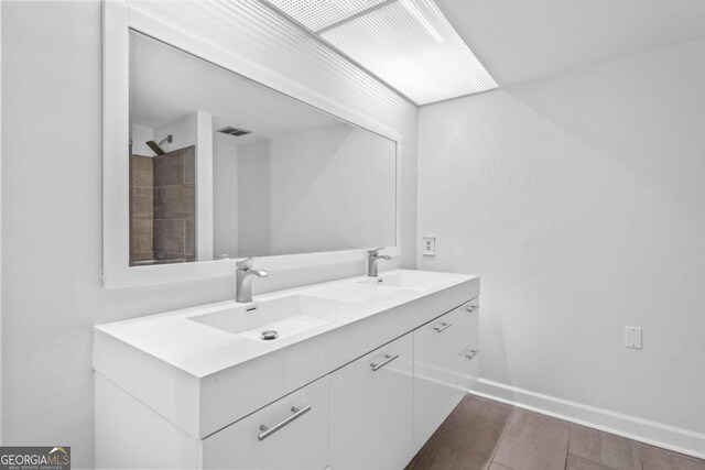 bathroom featuring vanity and hardwood / wood-style flooring