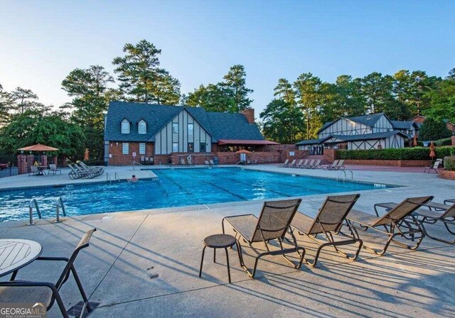 view of pool featuring a patio