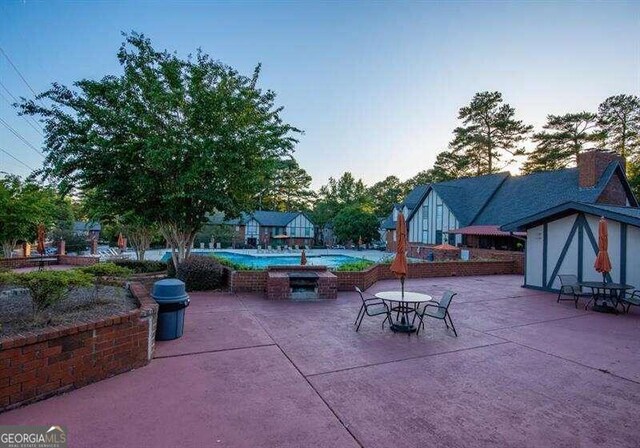 view of patio terrace at dusk