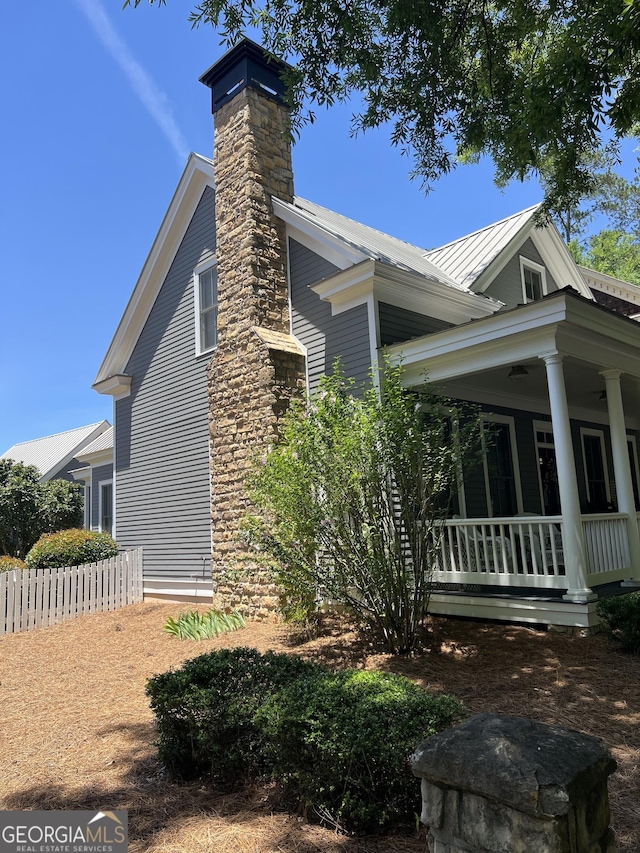 view of side of home featuring a porch