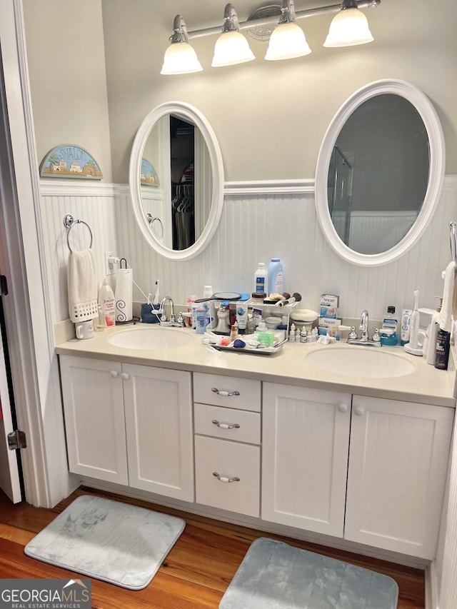 bathroom with wood-type flooring and vanity