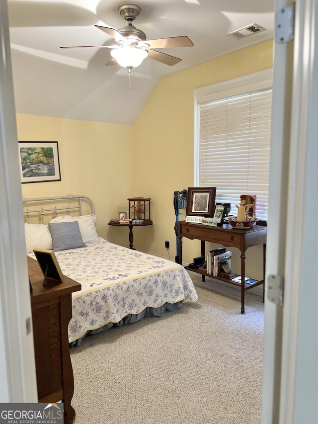 bedroom featuring carpet flooring, ceiling fan, and vaulted ceiling