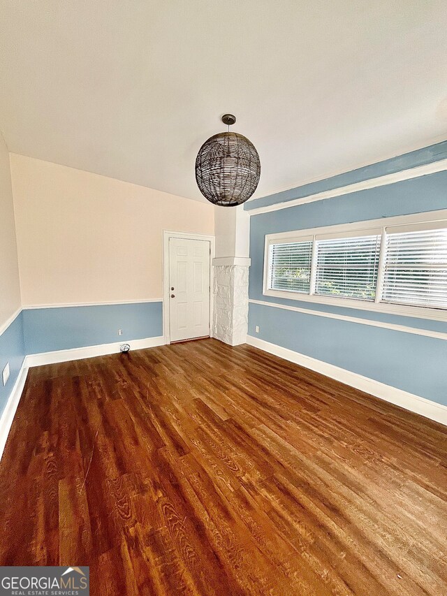 unfurnished room featuring wood-type flooring