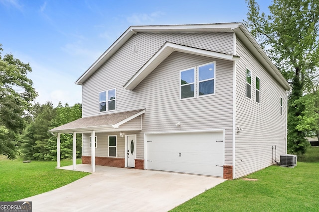 view of front of home with a garage, central air condition unit, and a front yard