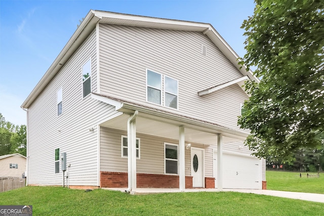 view of front property featuring a porch, a front yard, and a garage