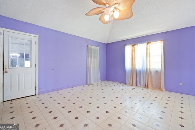 unfurnished bedroom with a textured ceiling and ceiling fan