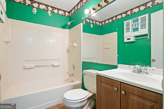 full bathroom with vanity, toilet, bathing tub / shower combination, and a textured ceiling