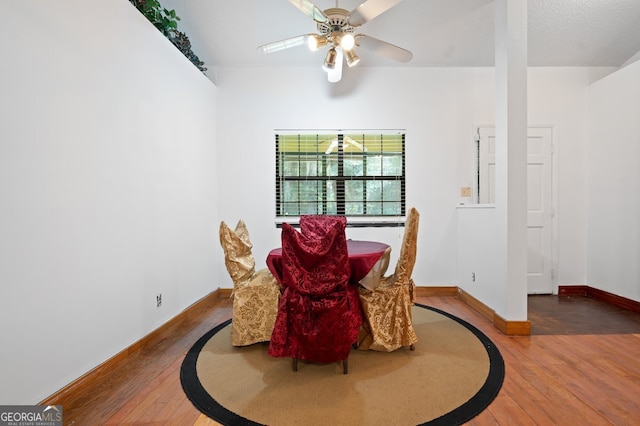 dining space featuring ceiling fan and hardwood / wood-style floors