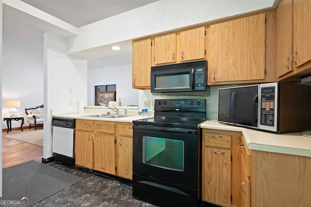 kitchen with sink and black appliances