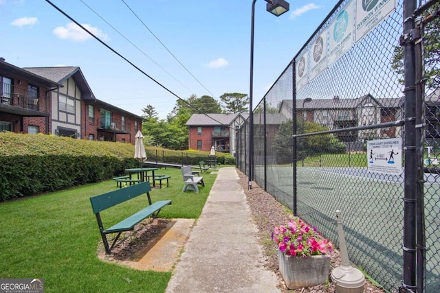 view of home's community featuring a lawn