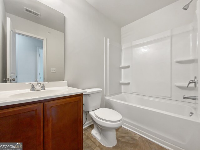 full bathroom featuring tile patterned floors, vanity, toilet, and shower / bathtub combination