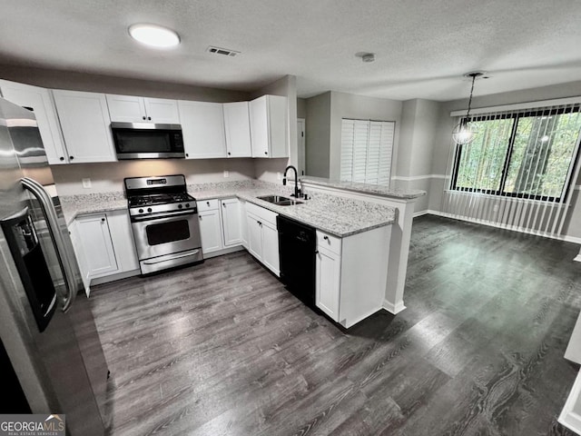 kitchen with kitchen peninsula, sink, white cabinetry, hanging light fixtures, and stainless steel appliances