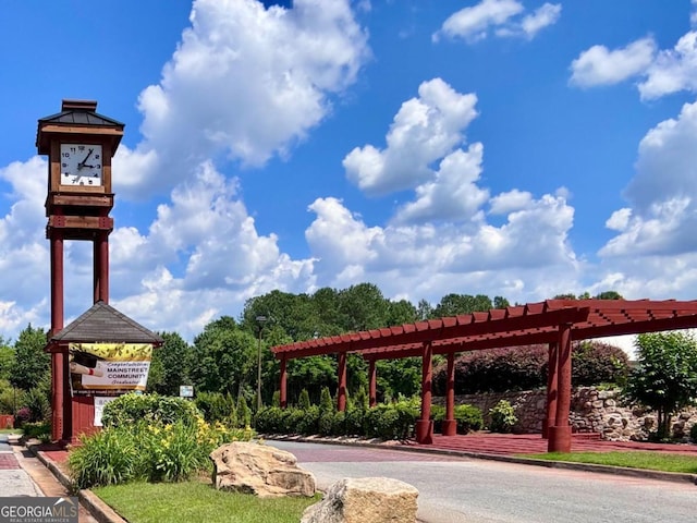 view of community featuring a gazebo and a pergola