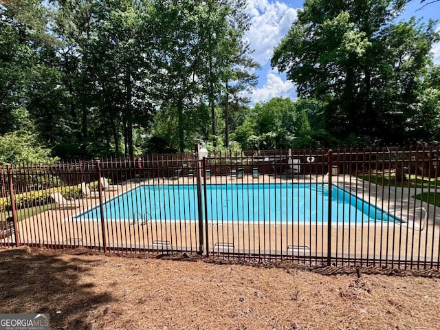 view of swimming pool with a patio