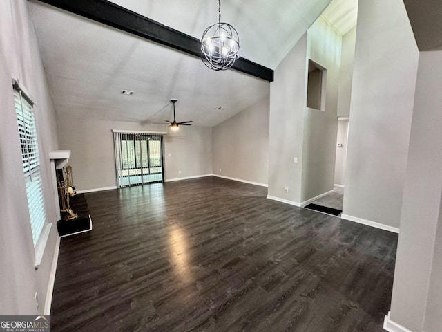 unfurnished living room with dark hardwood / wood-style flooring, beam ceiling, ceiling fan with notable chandelier, and high vaulted ceiling