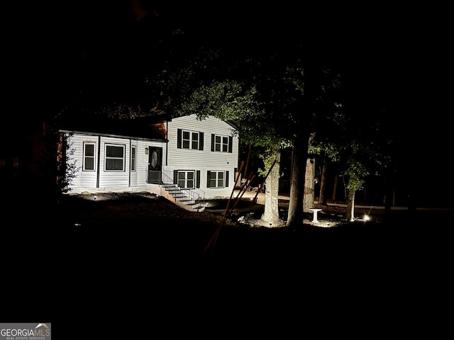 view of back house at night