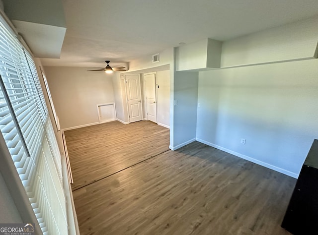 unfurnished room with hardwood / wood-style floors and ceiling fan