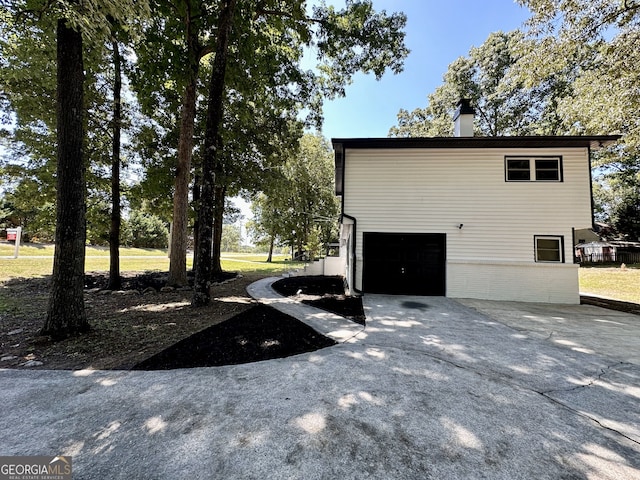 exterior space with a garage