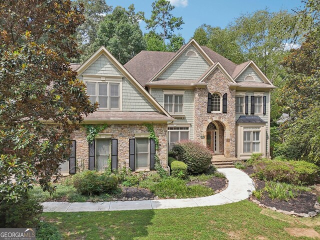 view of front of property with a front lawn