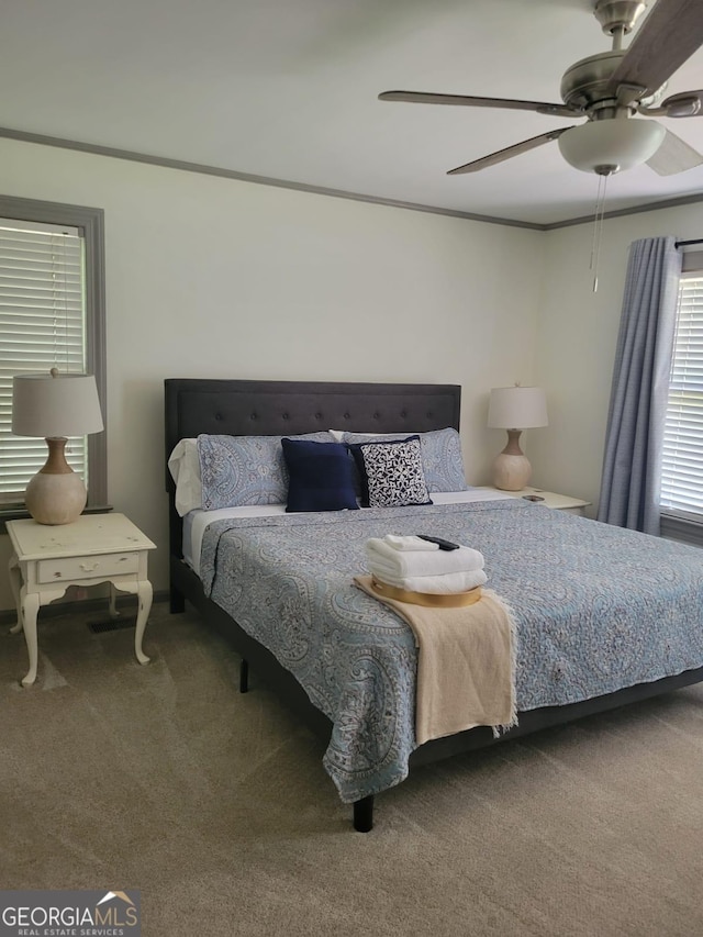 carpeted bedroom with ceiling fan