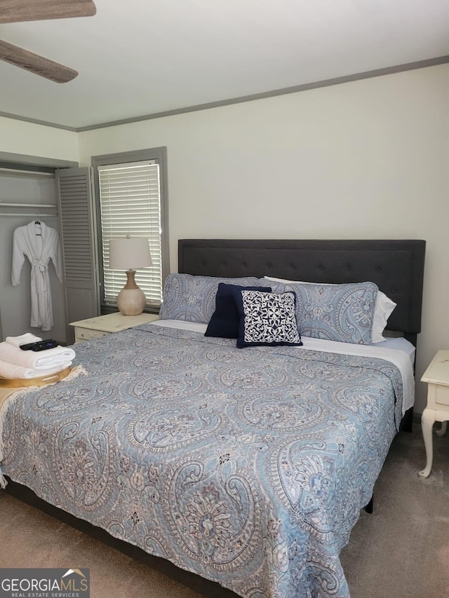 bedroom with ceiling fan, a closet, and carpet floors