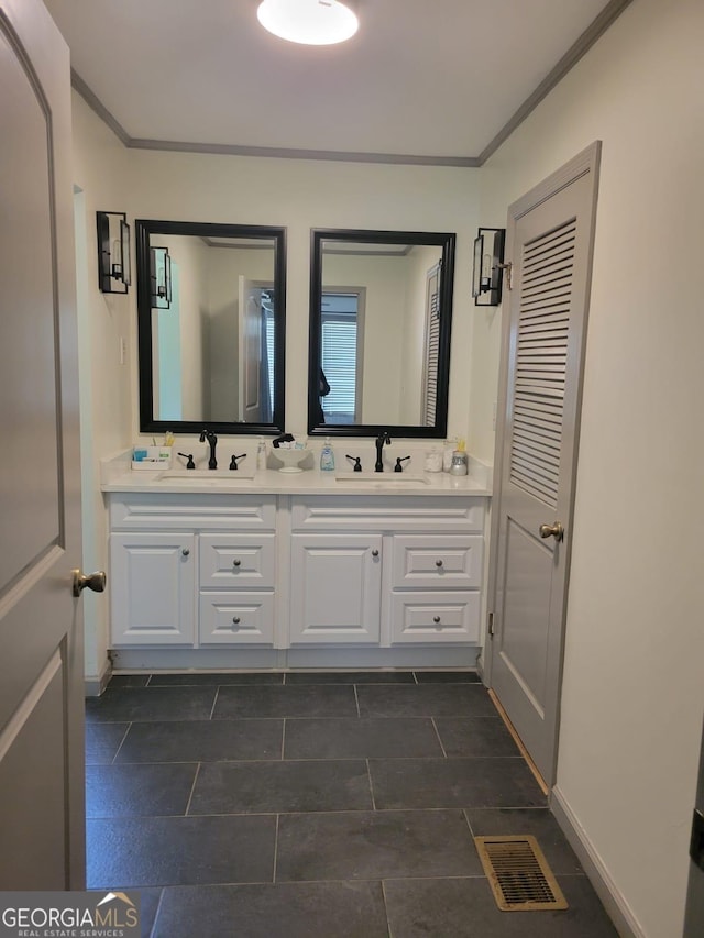 bathroom featuring vanity and ornamental molding