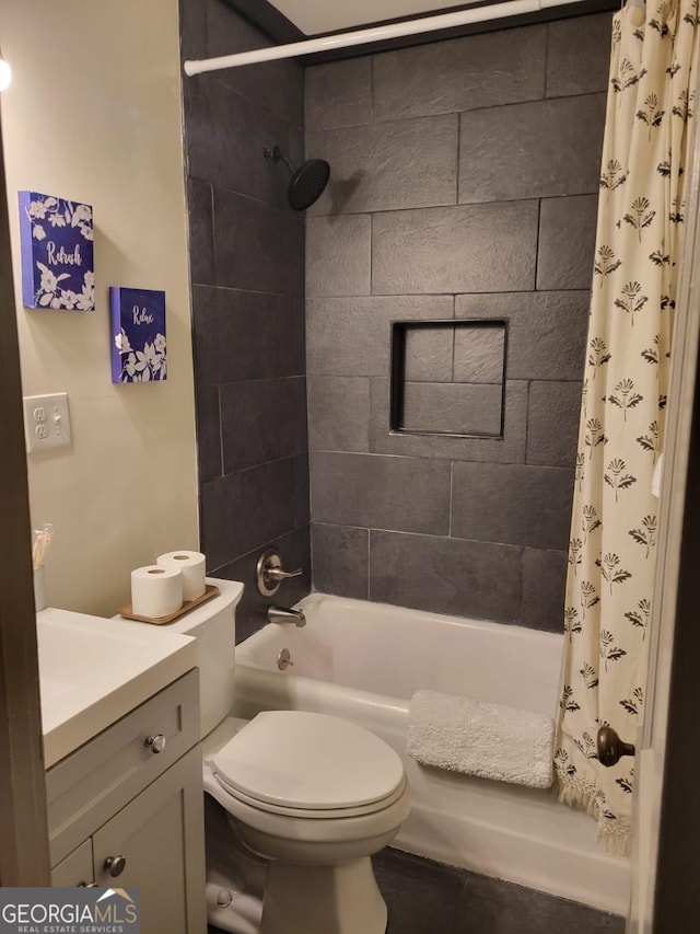 full bathroom with shower / tub combo, vanity, and toilet