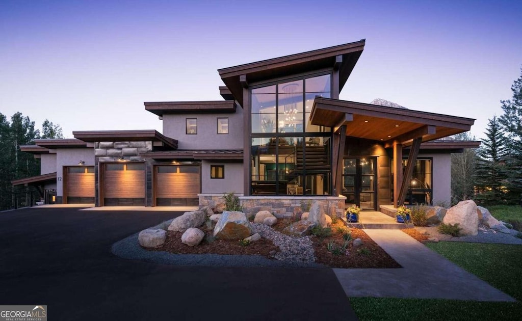 contemporary house featuring a carport