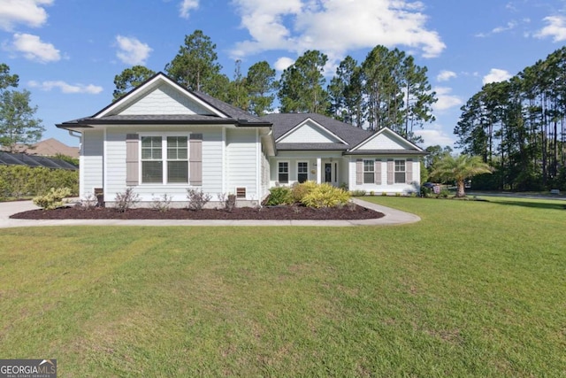 single story home with a front lawn