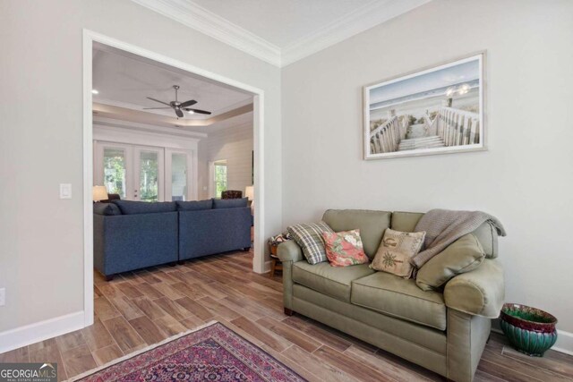 living room with crown molding, french doors, ceiling fan, and hardwood / wood-style floors