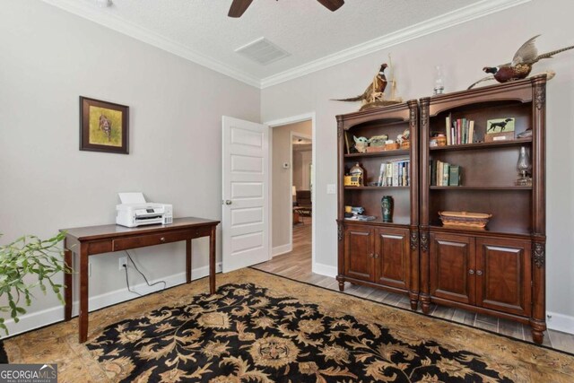 office area with crown molding, a textured ceiling, ceiling fan, and hardwood / wood-style floors