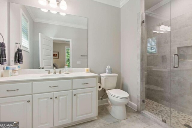 bathroom featuring an enclosed shower, tile floors, ornamental molding, toilet, and vanity