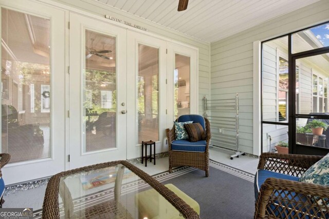 sunroom featuring french doors