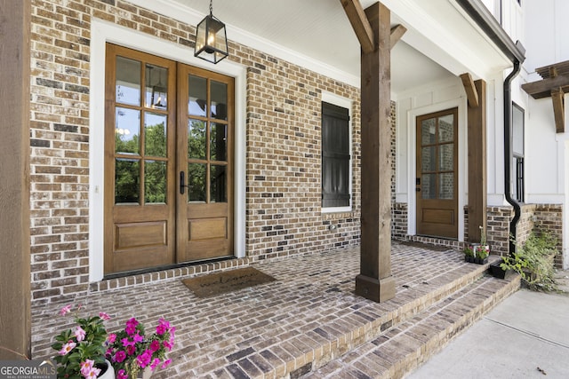 property entrance with a porch and french doors