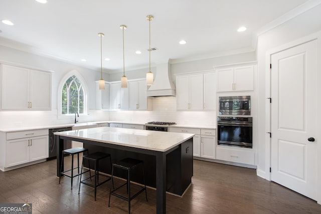 kitchen featuring premium range hood, a center island, stainless steel appliances, and dark hardwood / wood-style floors