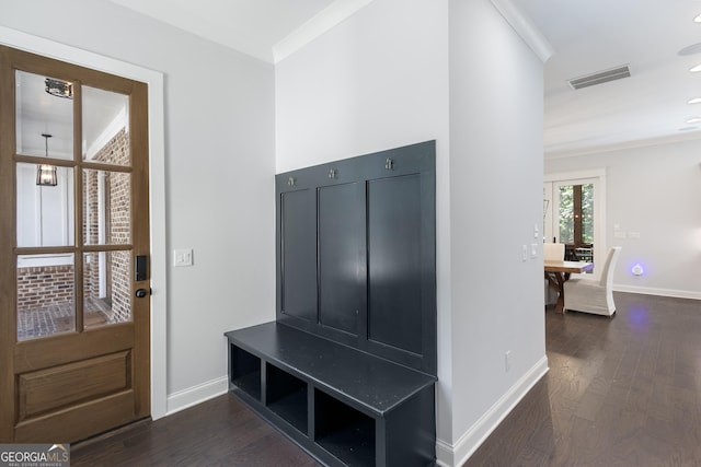 mudroom with crown molding and dark wood-type flooring