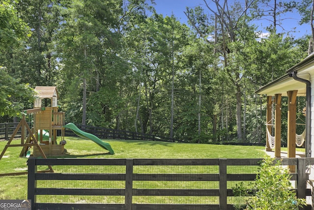 view of jungle gym featuring a yard