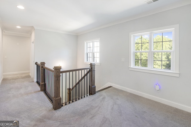 interior space featuring crown molding and light carpet