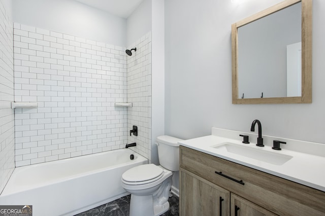 full bathroom with vanity, toilet, and tiled shower / bath