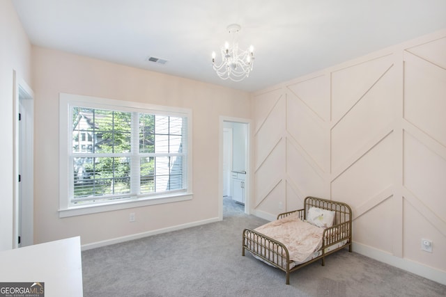 living area with light carpet and a chandelier