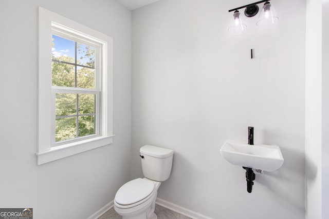 bathroom with toilet and sink